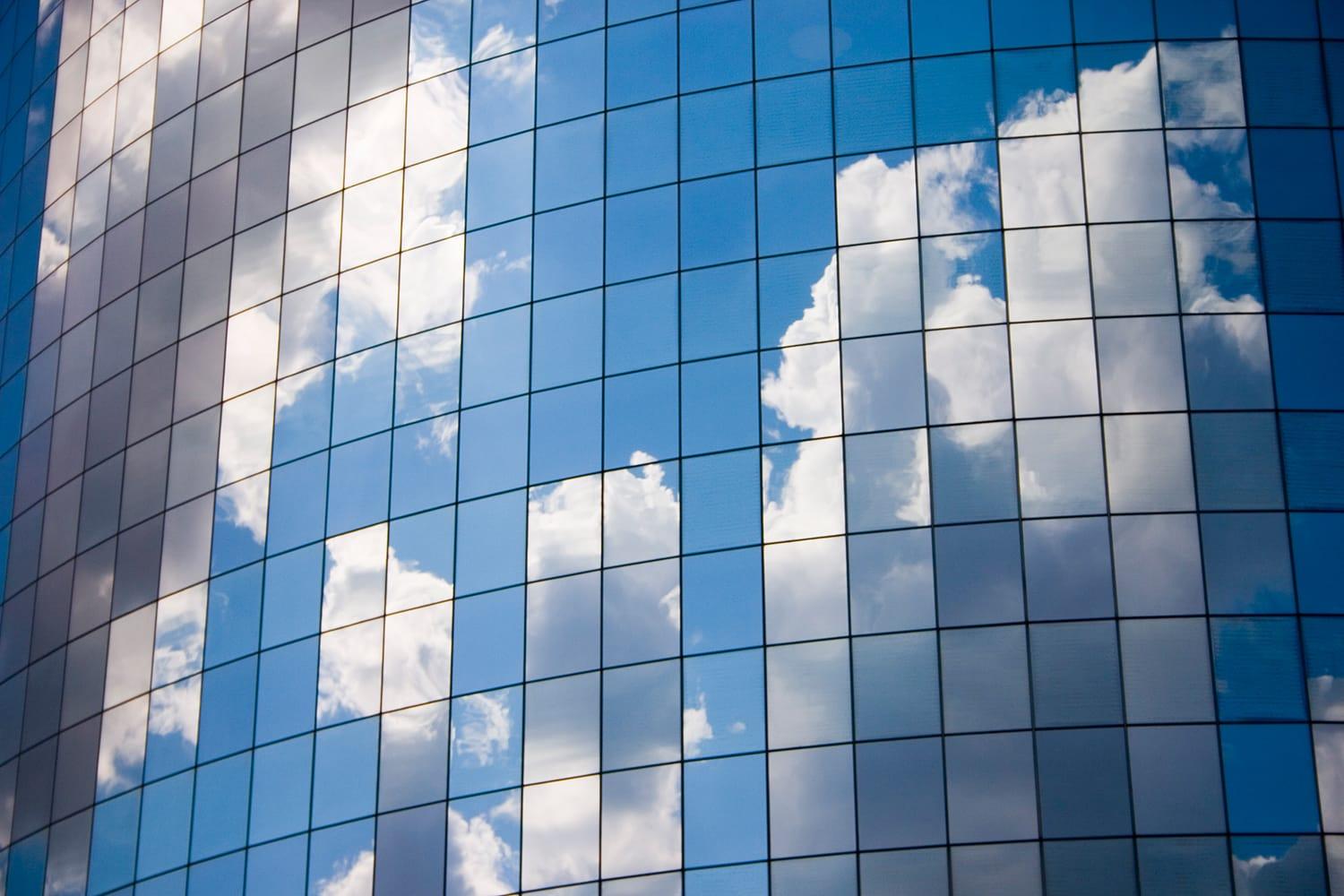 Clouds reflected on glass windows Clouds reflected on glass windows