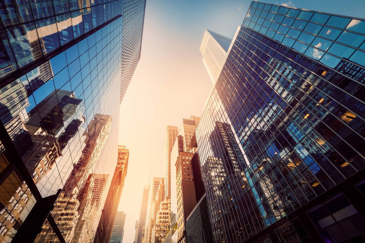 View of city buildings at sunrise