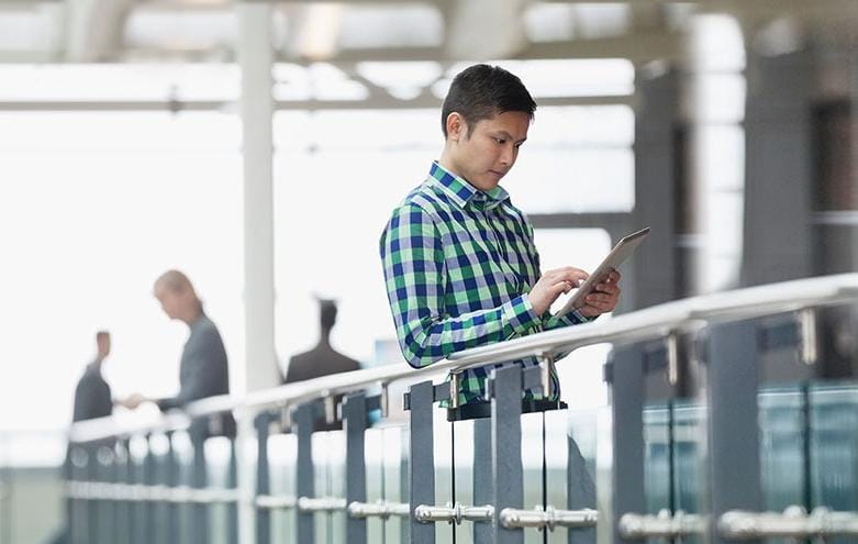 man looking at tablet