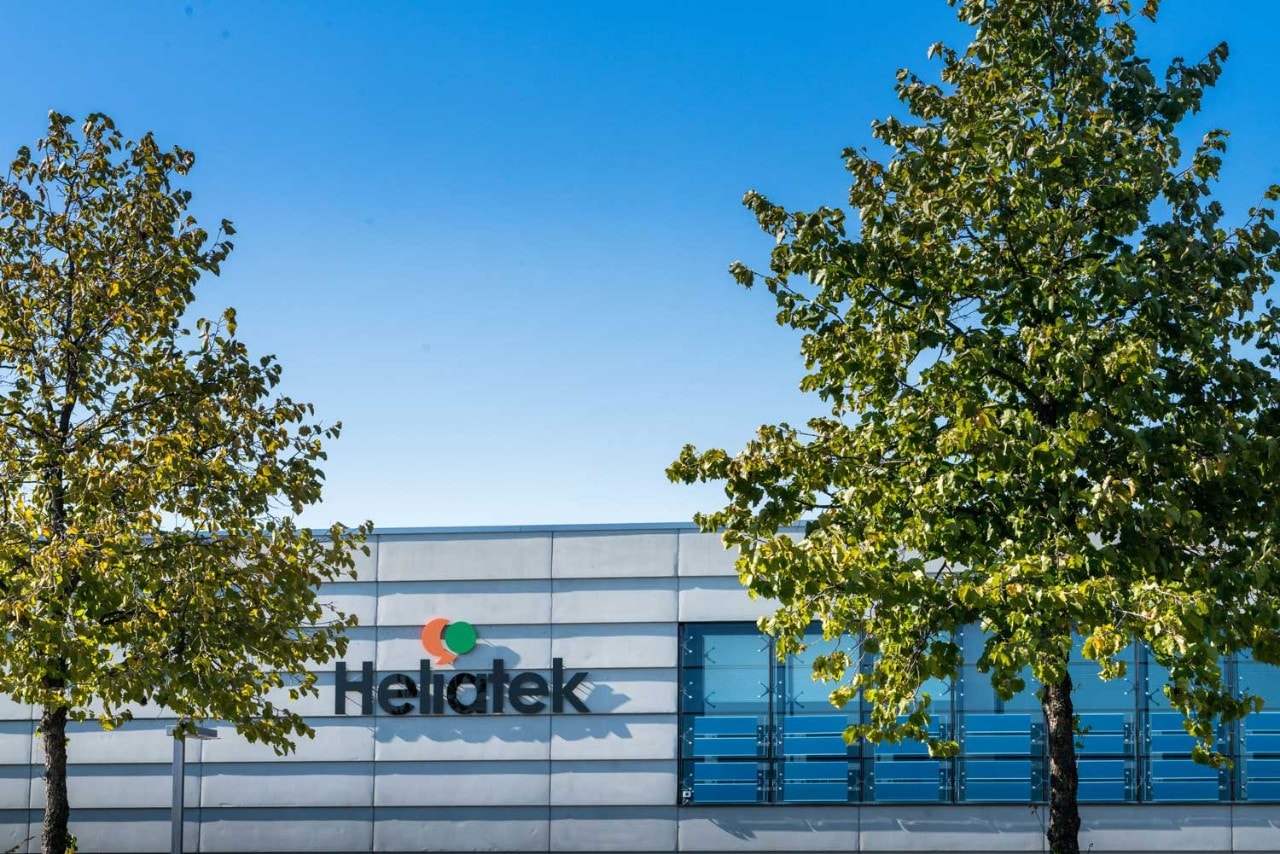 Healitek company sign between trees
