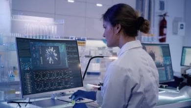 Female doctor looking at monitor in research laboratory