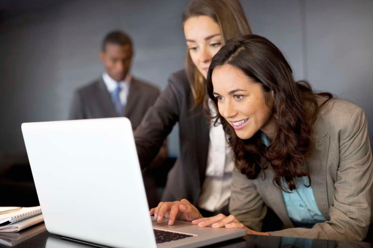 Business Women Looking at Laptop