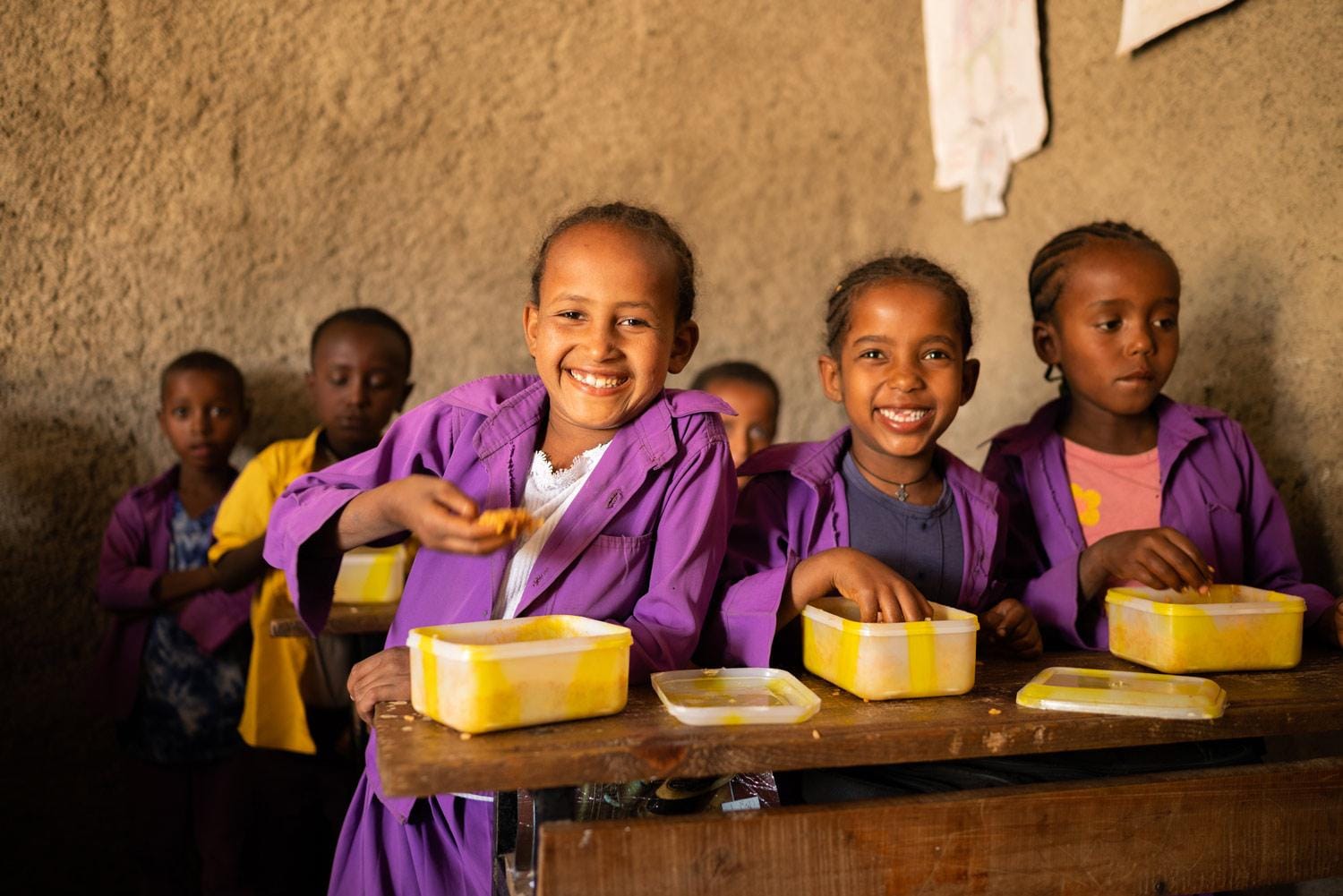 Compassion International children eating a meal together