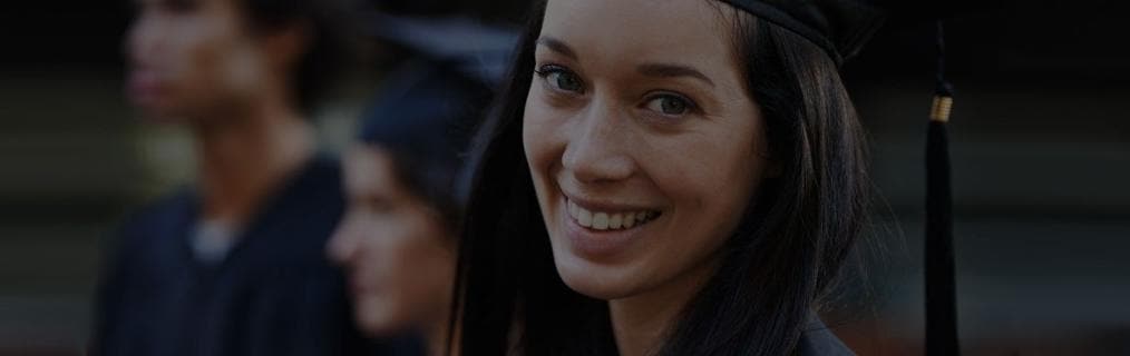 Recent College Graduate Smiling At Camera