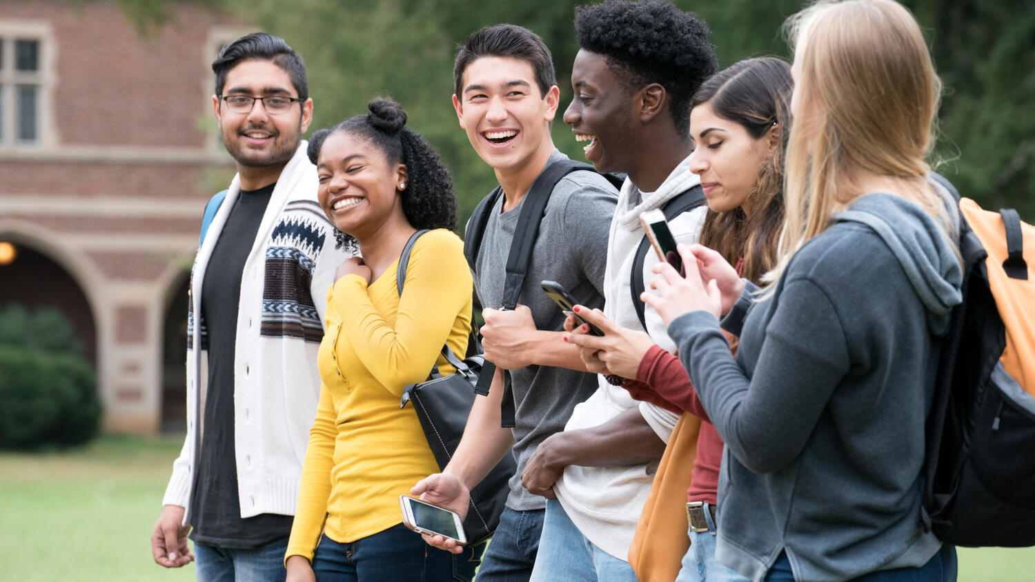 Diverse group of college students walking outside