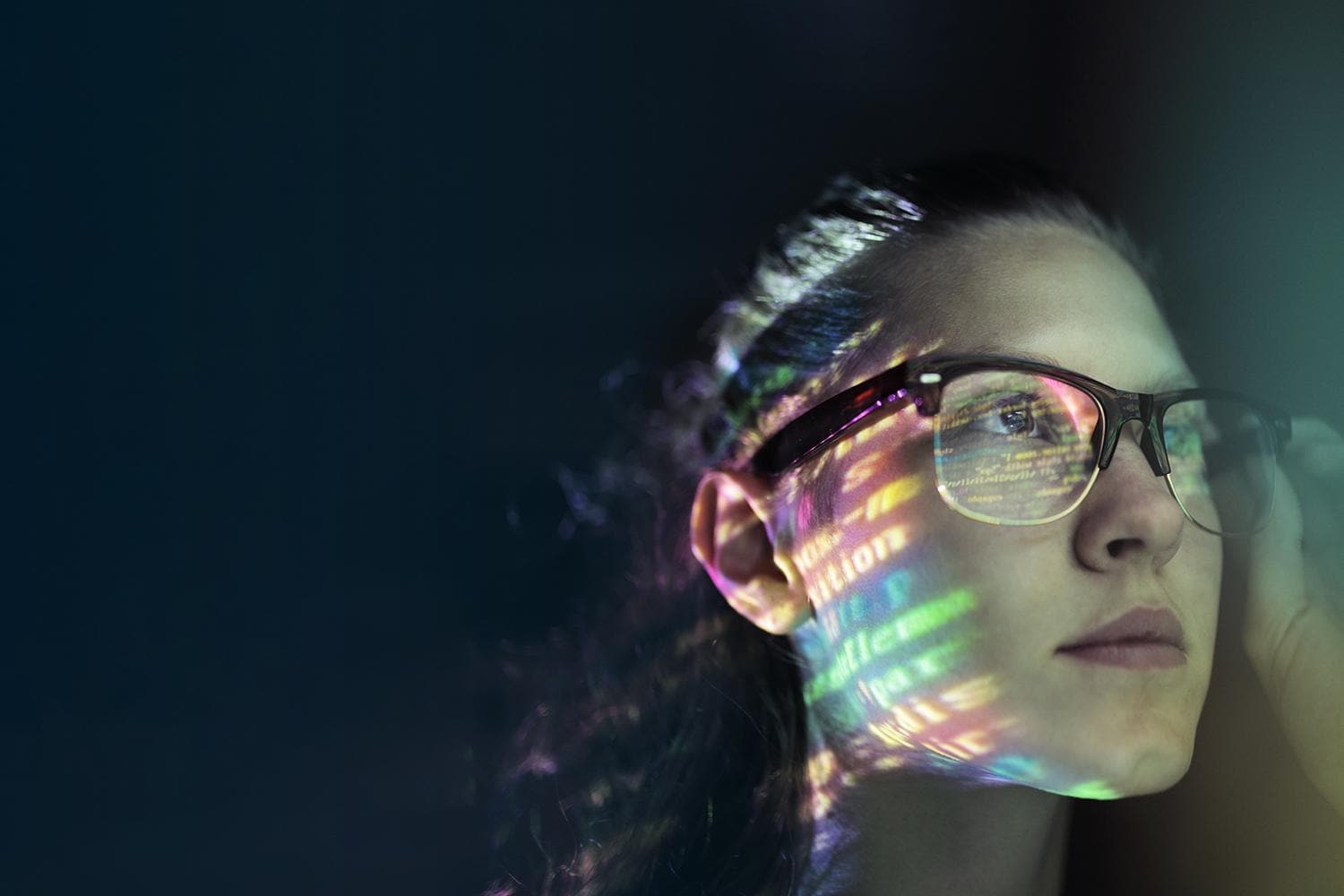 Portrait, girl lighted with colorful code  
