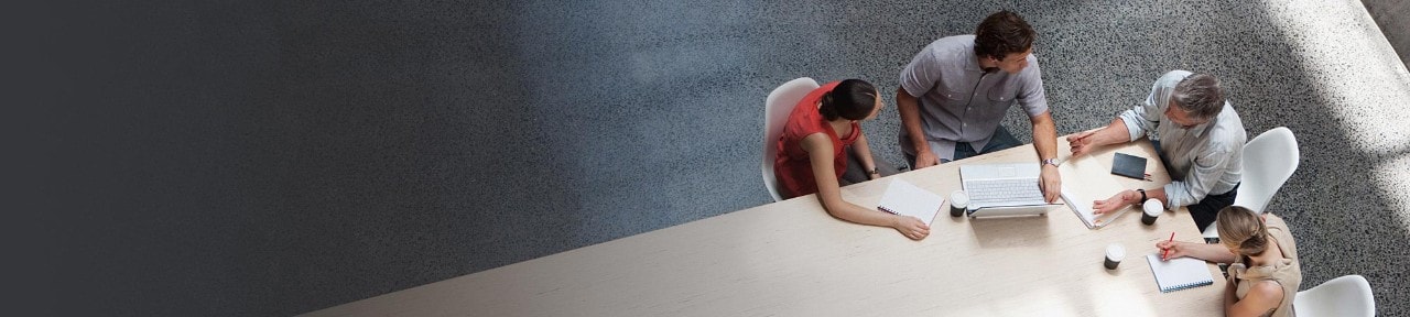 Group of workers meeting around a conference table