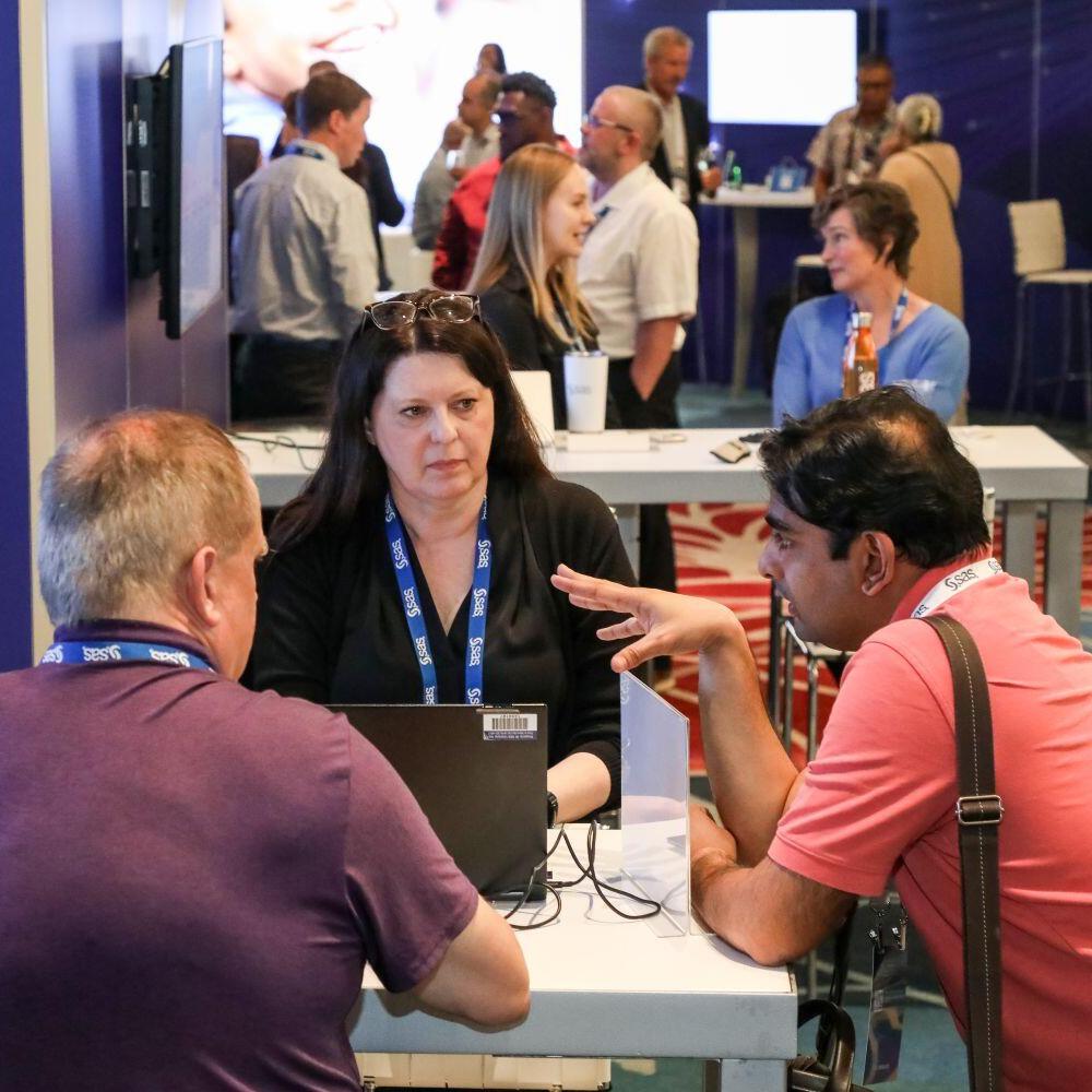 People talking in the Innovation Hub at SAS Innovate