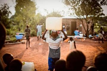 Child Carrying Water on Head
