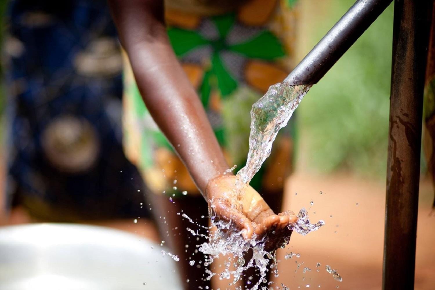 Hand in Water Pump