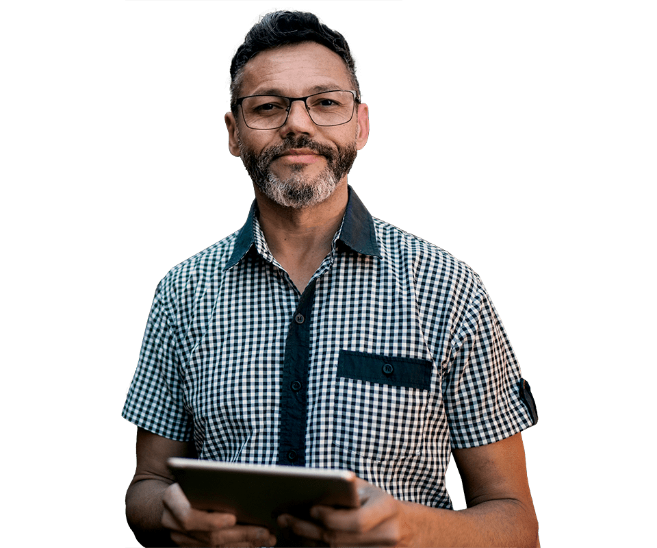 Man with glasses in checked shirt holding tablet
