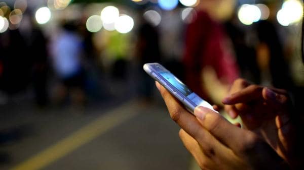Women using smartphone at night
