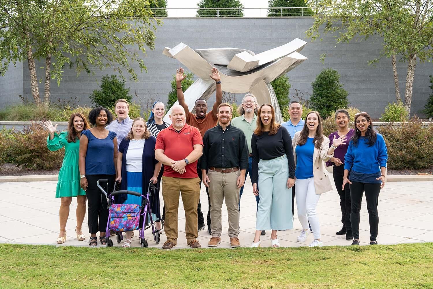 Diversity and Inclusion Coworkers laughing while taking a photo outside