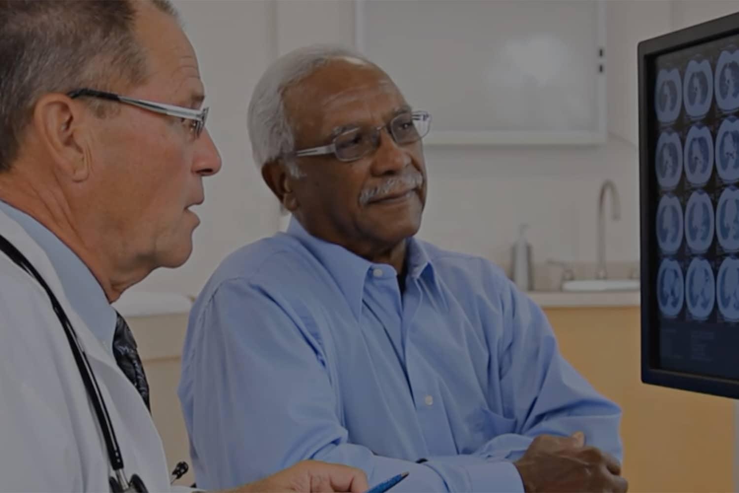 Doctor discussing scan with patient Doctor discussing scan with patient