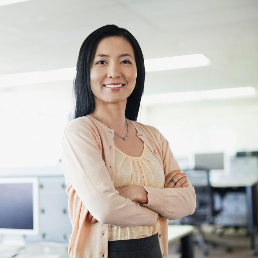 Asian Woman Standing In Office