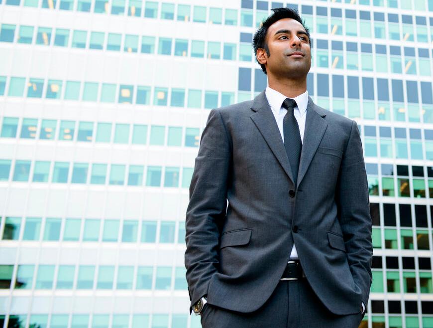 Business professional in suit symbolizing SAS Academy for Data and AI Excellence, certification bootcamps in GenAI, analytics, and data science careers in India.