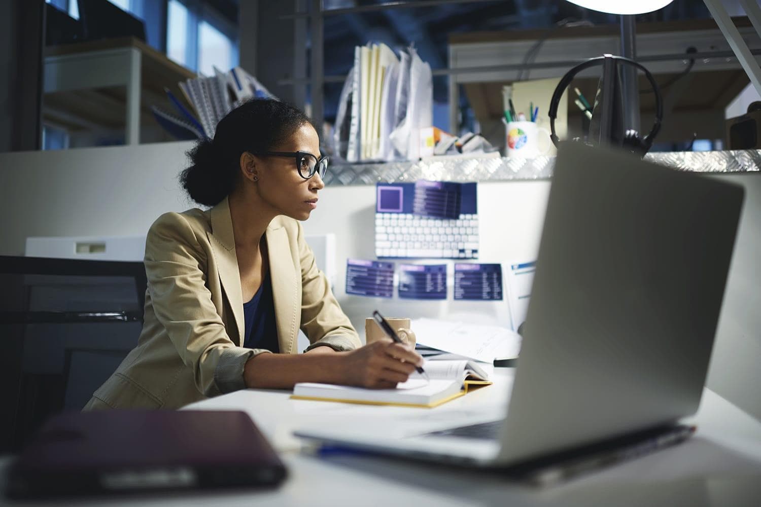 Female data scientist preparing reports on computer Female data scientist preparing reports on computer