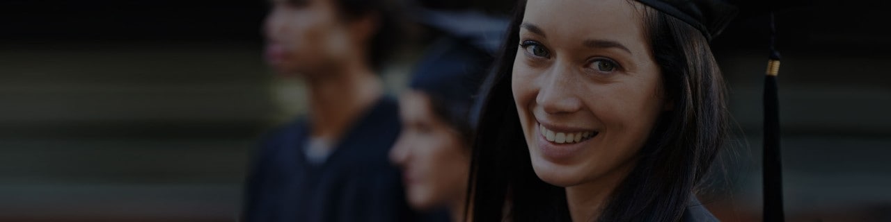 Recent College Graduate Smiling At Camera Recent College Graduate Smiling At Camera