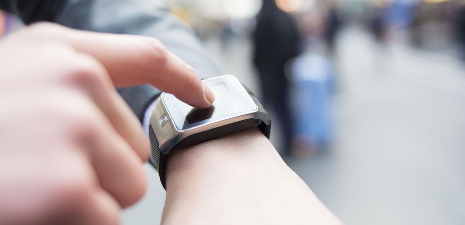 Person touching watch Person touching watch