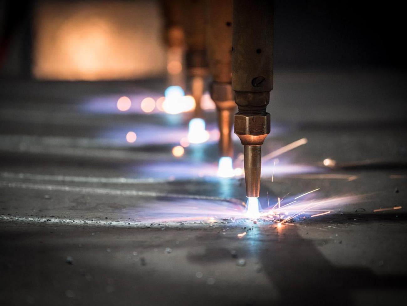 Machines welding and throwing off sparks