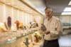 Portrait of Jim Goodnight with mineral collection