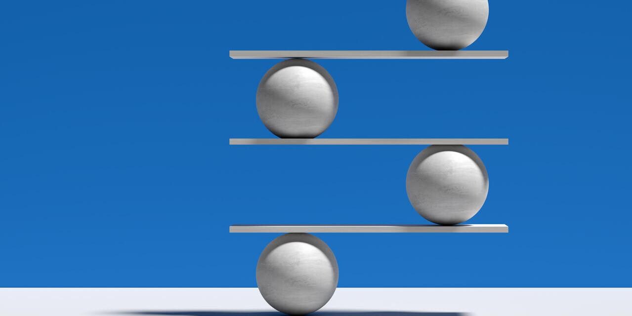 Spheres balancing on a seesaw