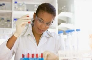 Scientist performing analysis in laboratory 