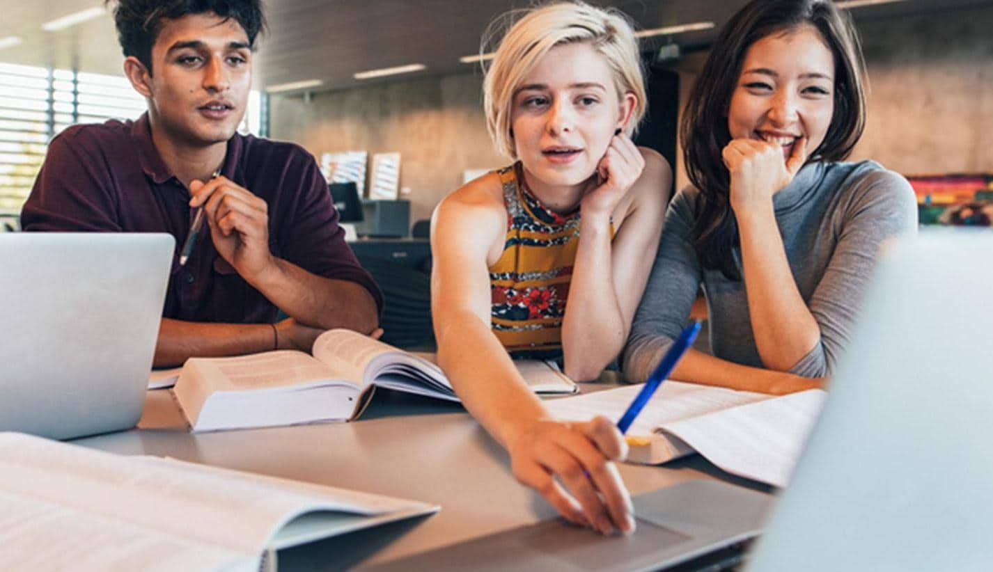 Young students working on a laptop