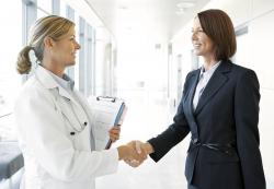 doctor greets business person