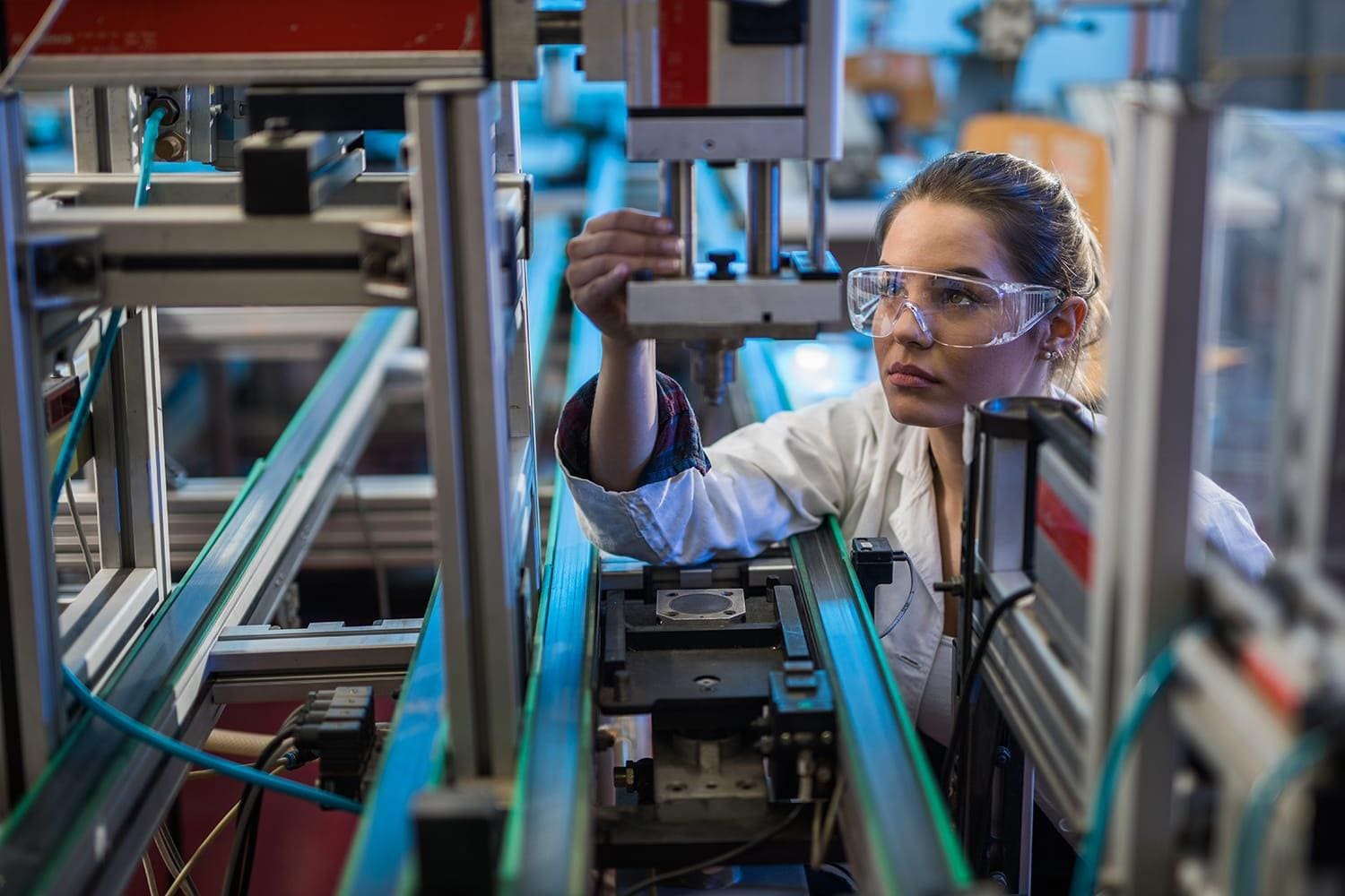 Person in lab working with safety glasses on