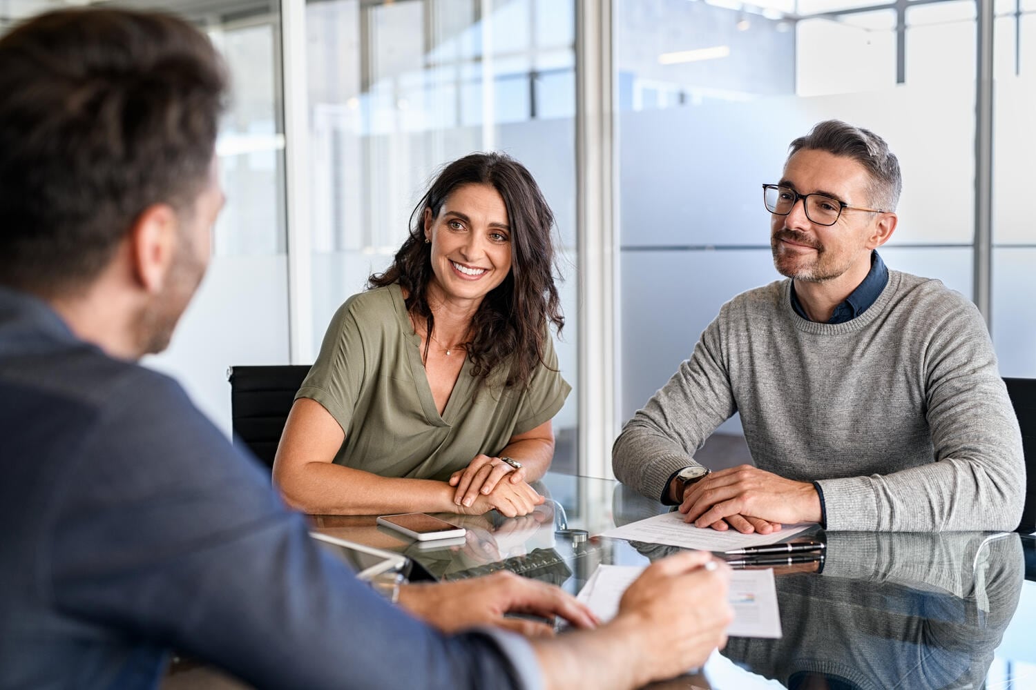 couple meeting with an insurance agent giving advice