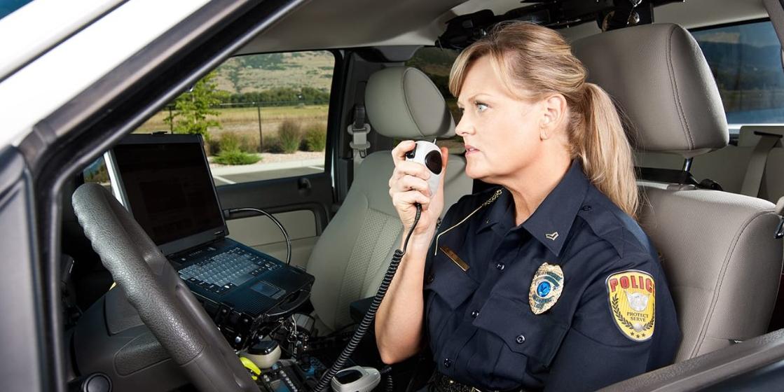 Female law enforcement officer in car