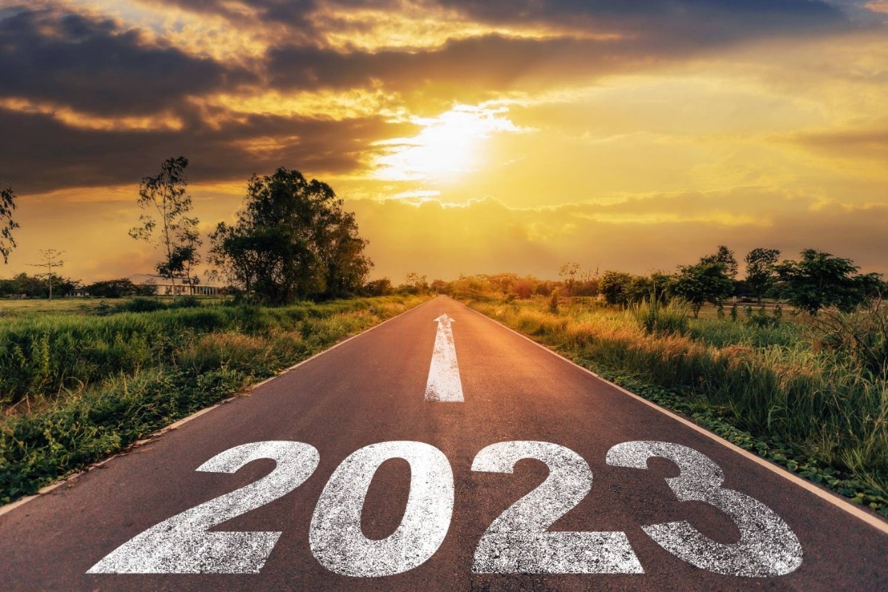 Roadway marked 2023 with arrow toward horizon