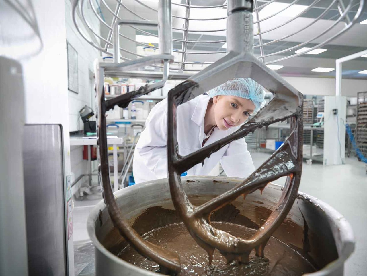woman stirring chocolate in a bakery