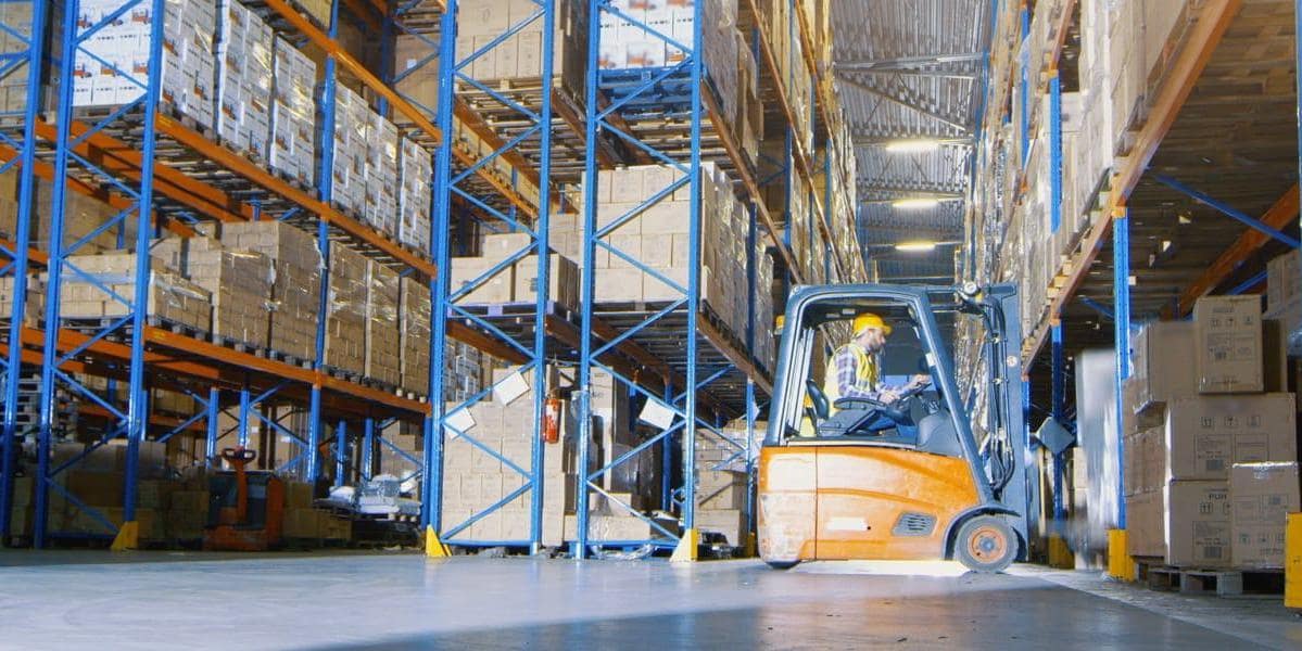 Warehouse worker on forklift Warehouse worker on forklift