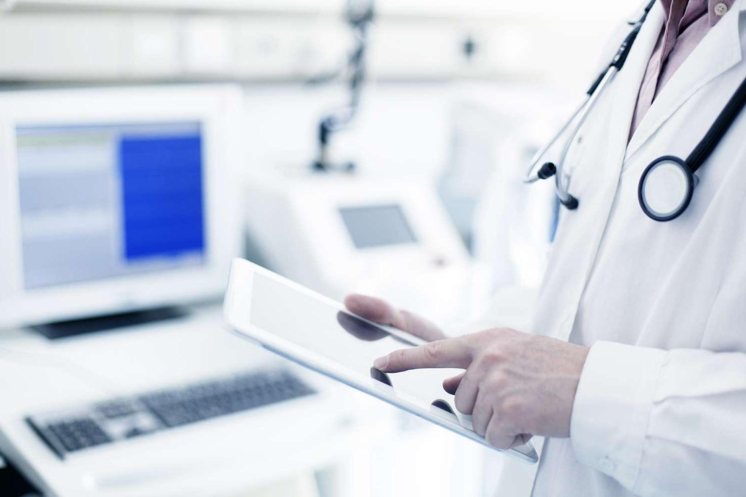 Doctor using digital tablet in hospital Doctor using digital tablet in hospital