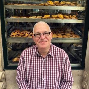 Nigel Armstead in front of bakery window