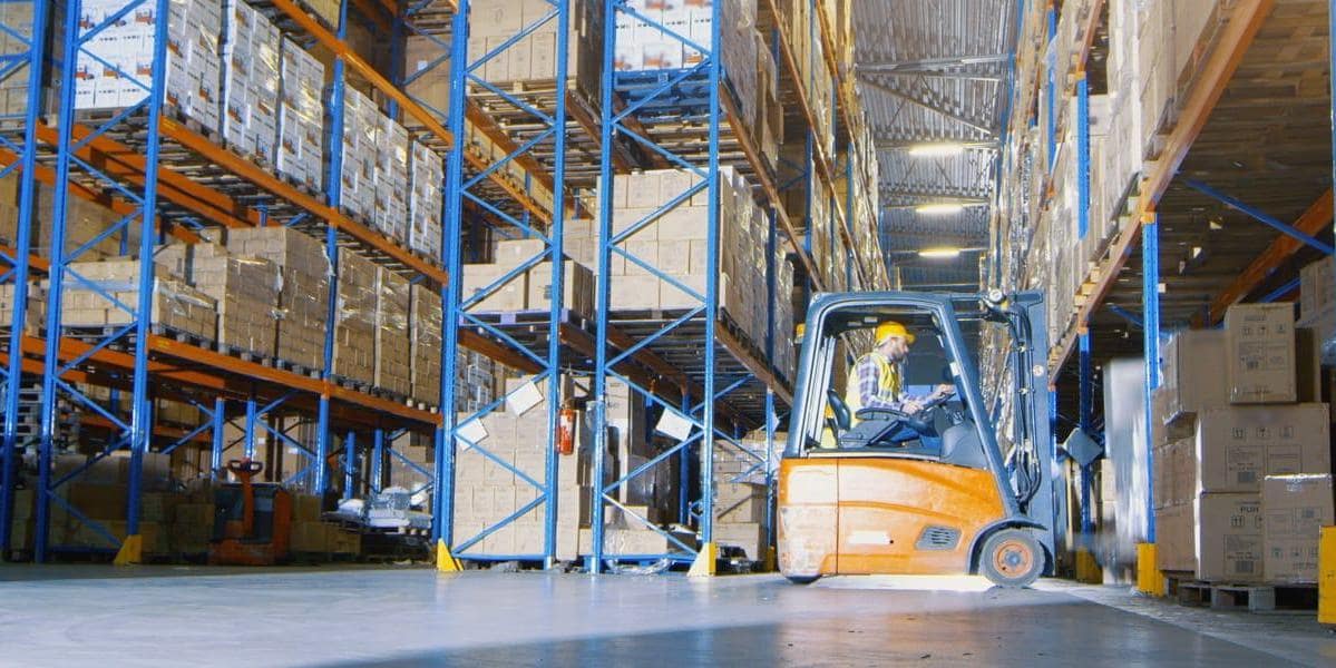 Warehouse worker on forklift