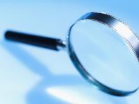 magnifying glass to perform an ORSA self-assessment of risk