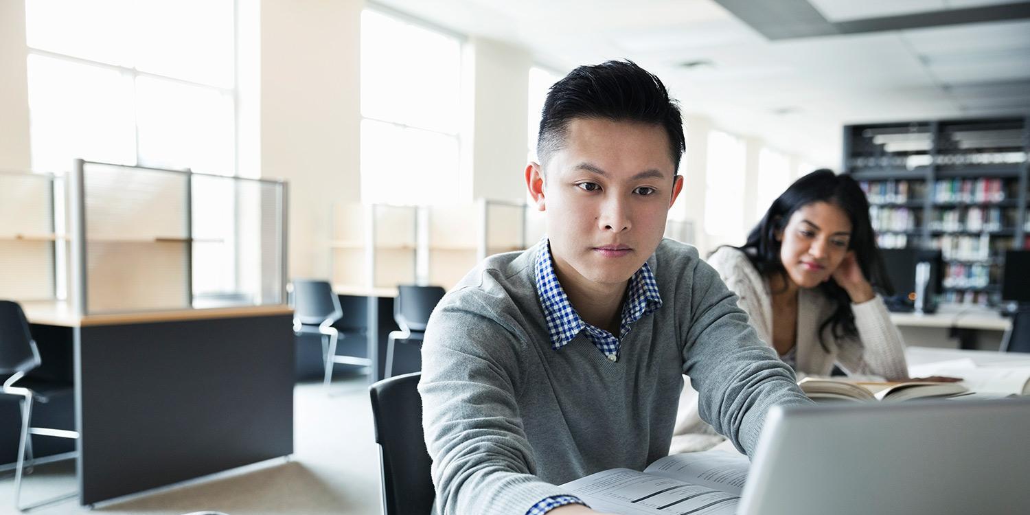 Young man working at laptop