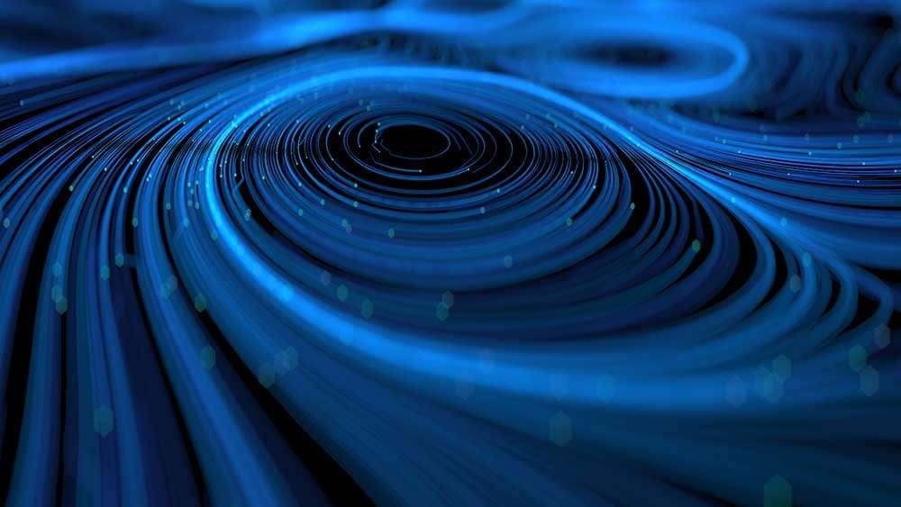Particle lines in a midnight blue spiral.