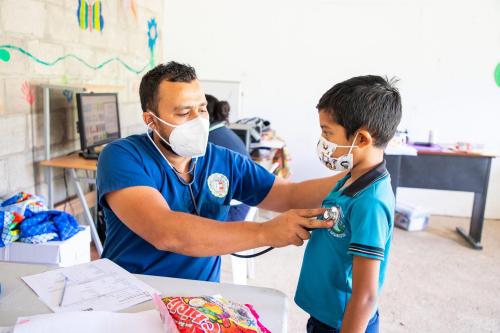 Compassion International child receiving a health checkup