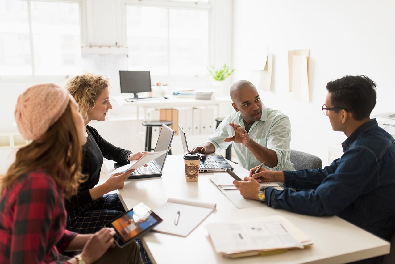 Young team of coworkers having brainstorming session