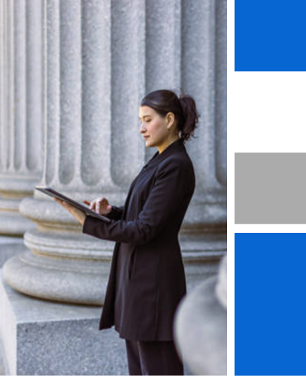 woman-looking-at-a-tablet-in-front-of-a-governement-building