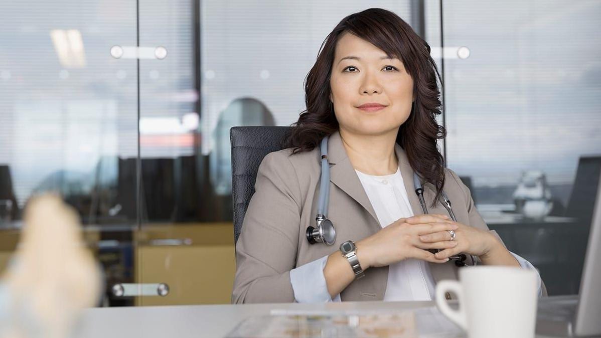 Portrait of confident doctor in conference room