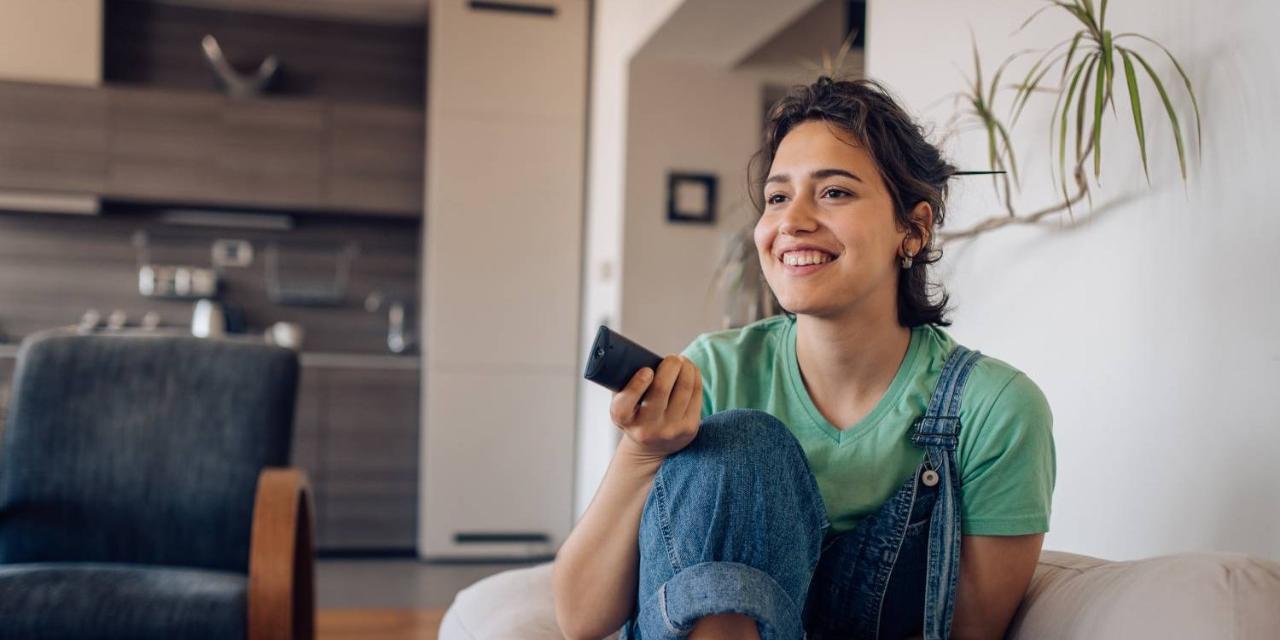 Woman enjoying television at home