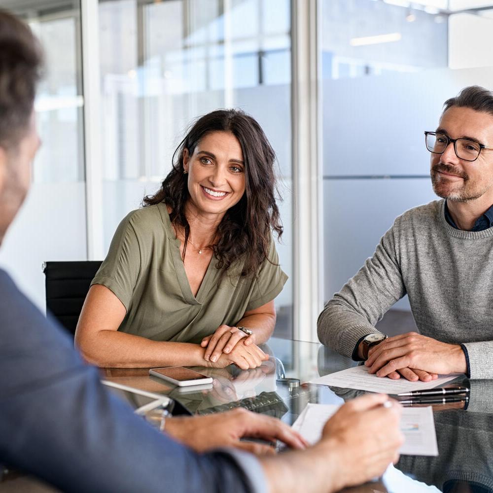 Couple meeting financial adviser for investment
