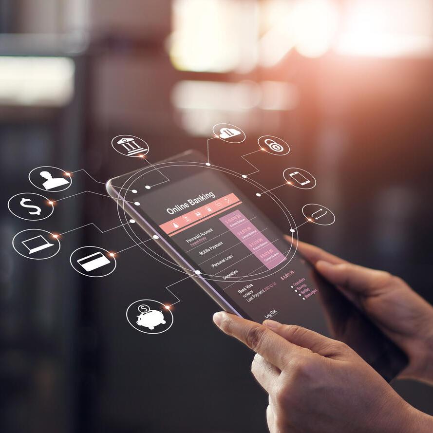 Man's hands using online banking app and icons on tablet device