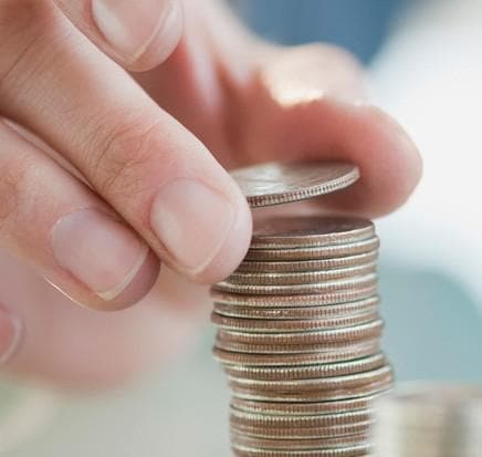 man stacking coins man stacking coins