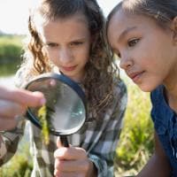 Girls with magnifying glass